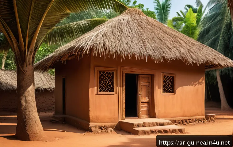 기니에서 전통 가옥과 현대식 주거 형태 비교 - A traditional Guinean village house made of natural materials like clay, wood, and palm leaves, feat...